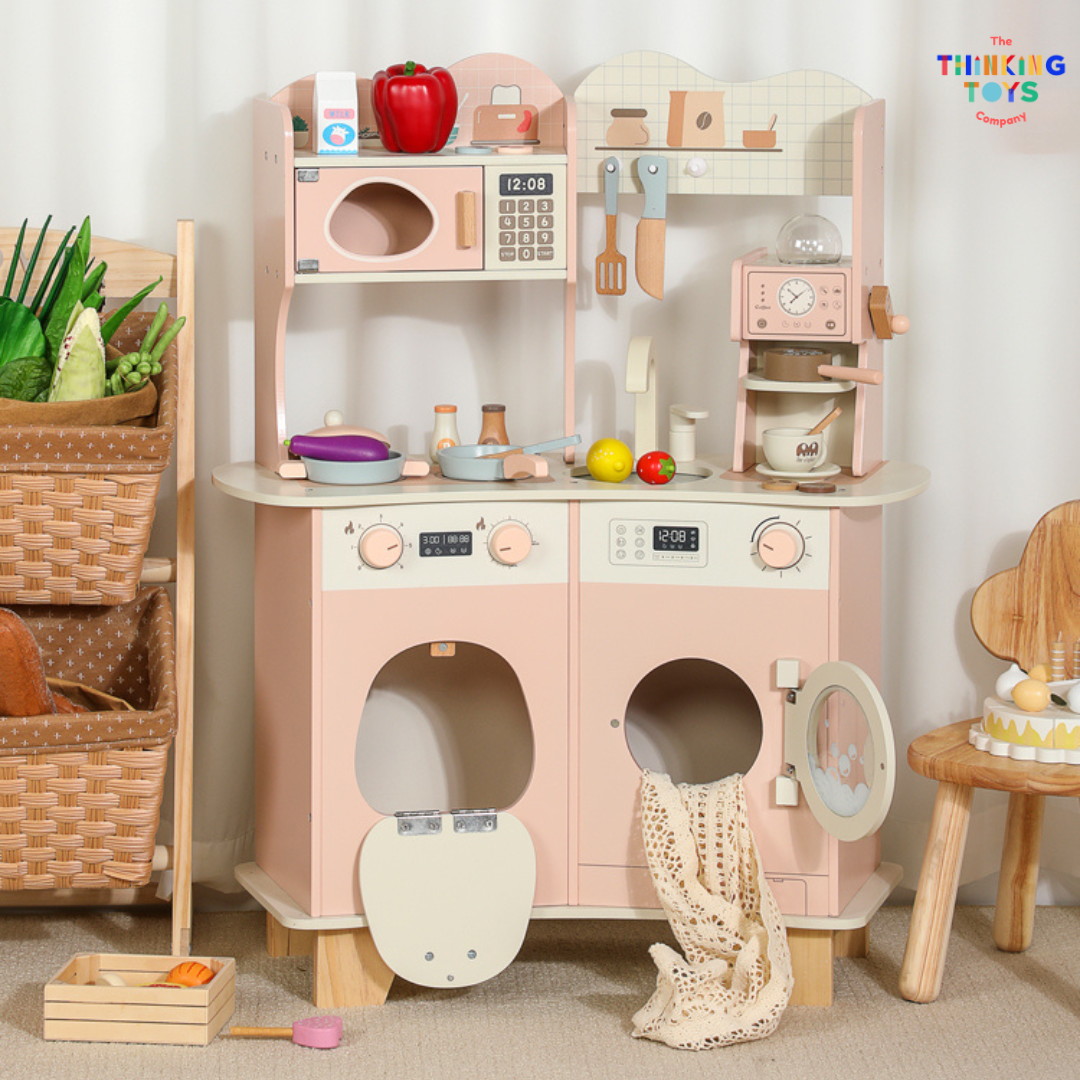 KP011, PLAYSHOP Cassey Corner Kitchen with Laundry, The Playshop Corner Kitchen with Laundry is a 2-in-1 pretend play set designed for little homemakers. With a compact corner design, it features a cooking station and a mini laundry area, encouraging kids to explore both cooking and cleaning through play. This wooden playset promotes creativity, role play, and independence, helping children understand everyday routines while having fun. Perfect for small spaces, it blends durability and child-safe design fo